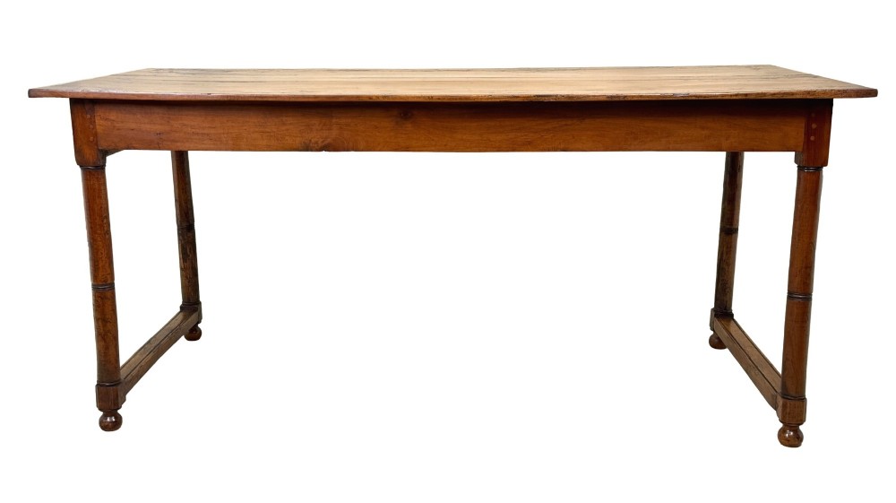 A 19th-century French Provincial fruitwood farmhouse table featuring a rectangular plank top, single end drawer, turned legs, and lower side stretchers. View IV