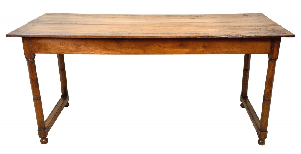 A 19th-century French Provincial fruitwood farmhouse table featuring a rectangular plank top, single end drawer, turned legs, and lower side stretchers. View IX