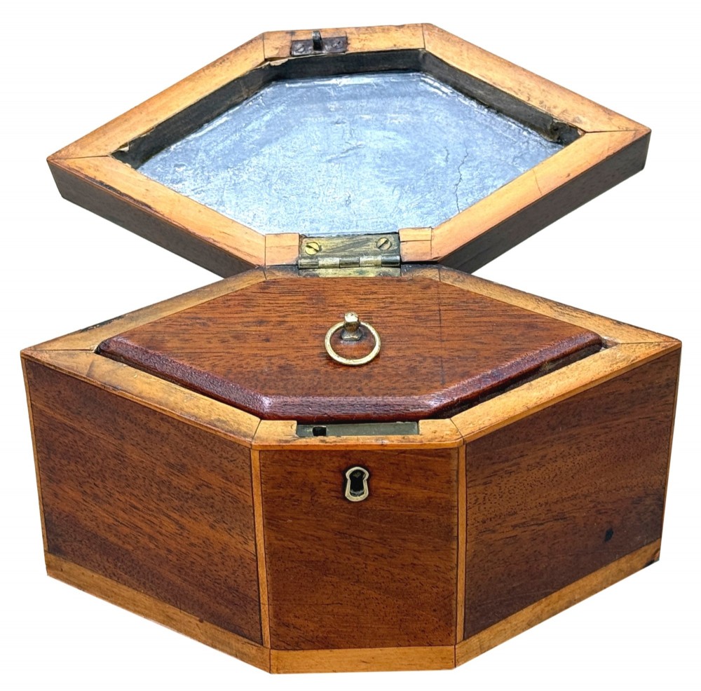 An 18th-century Georgian hexagonal mahogany tea caddy with line inlay and a shell medallion on the lid. View III