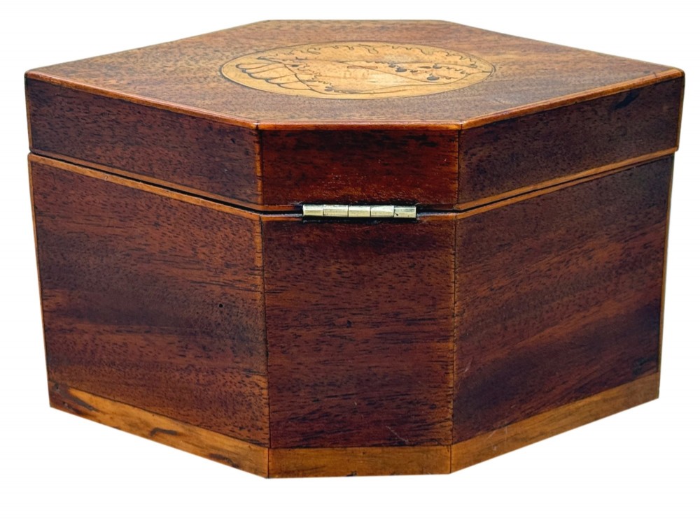 An 18th-century Georgian hexagonal mahogany tea caddy with line inlay and a shell medallion on the lid. View VII