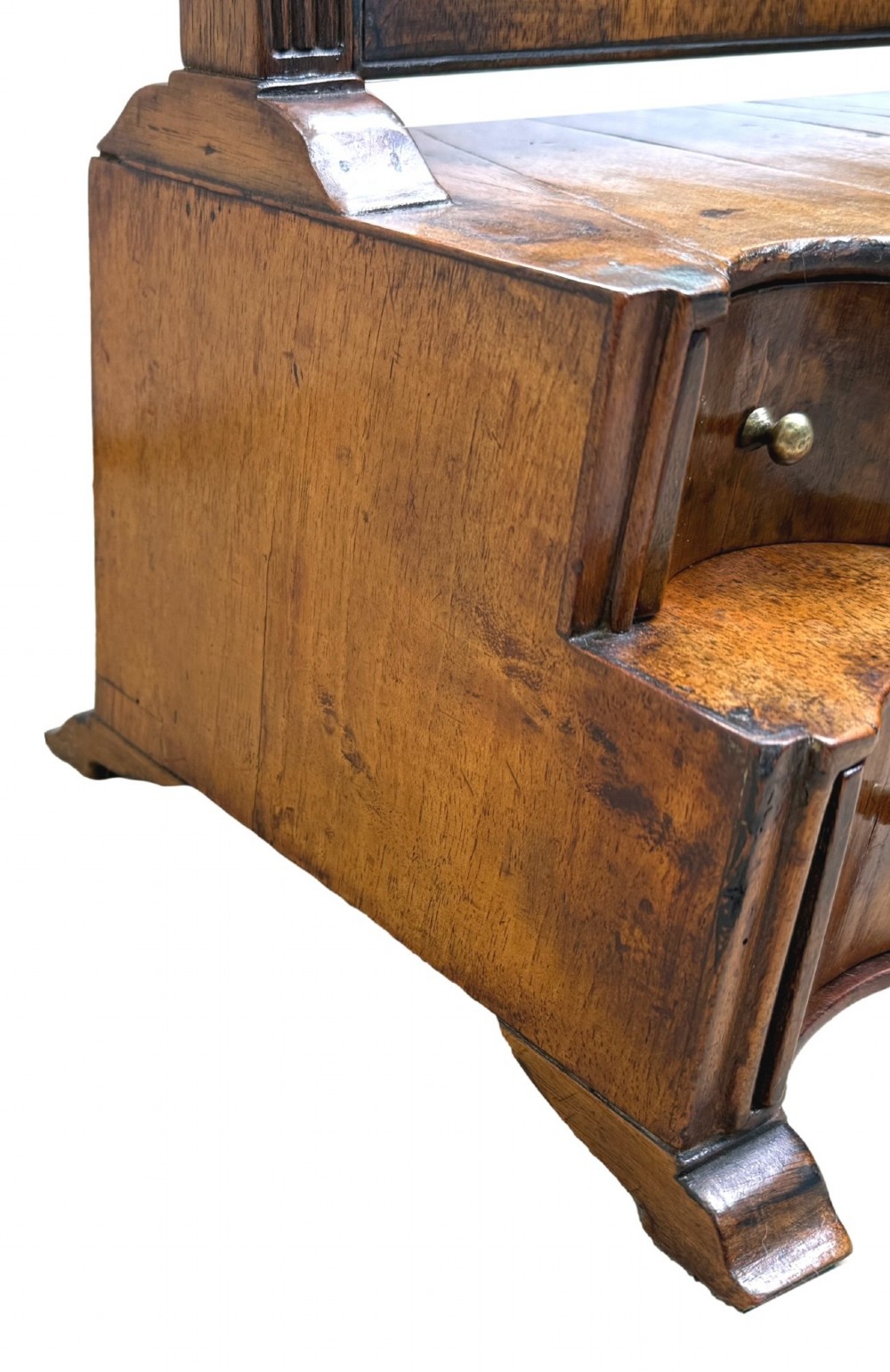 A Queen Anne early 18th-century walnut dressing table mirror featuring an arched swing frame resting above a stepped serpentine base with small drawers and brass hardware. View XIII