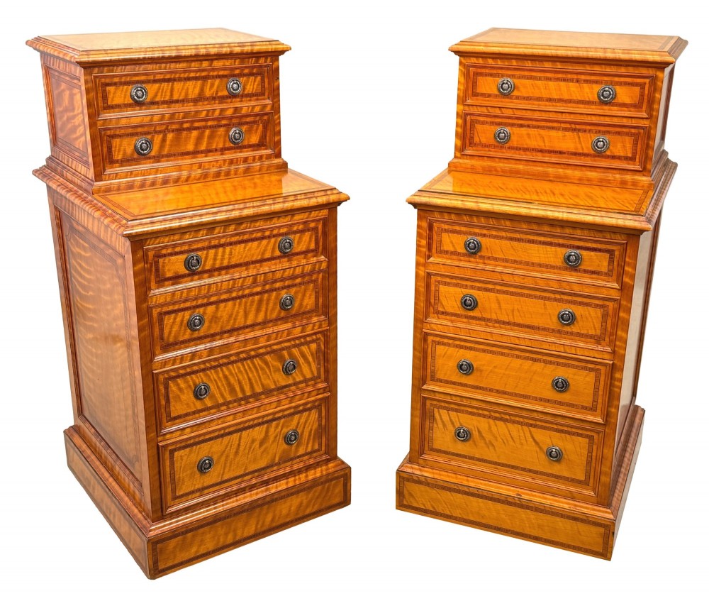 A pair of 19th-century golden satinwood bedside chests featuring stepped top sections with drawers, crossbanded inlay, and brass ring handles. View VII