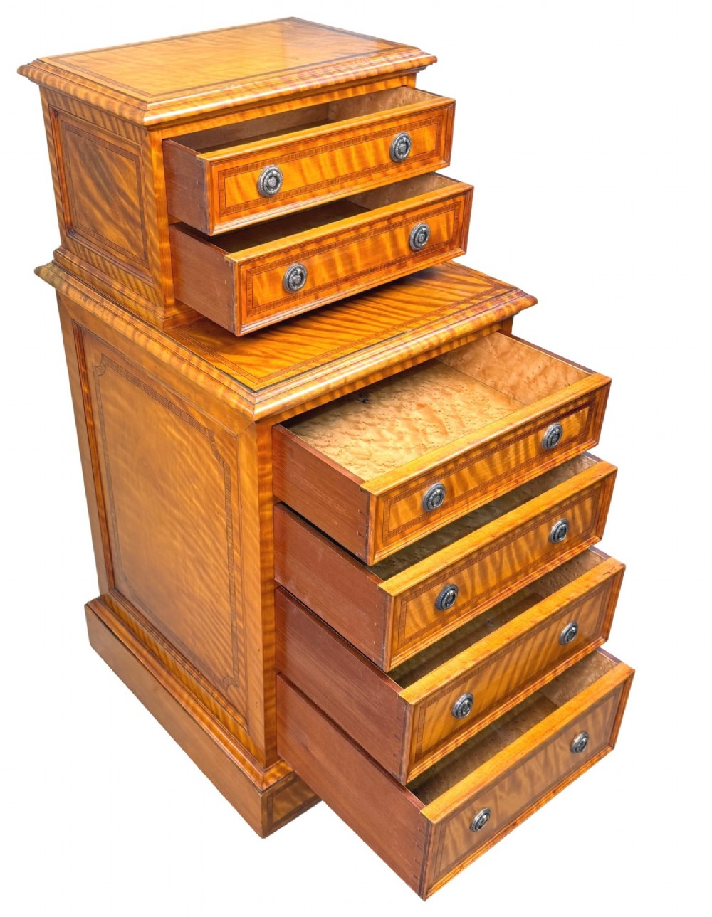 A pair of 19th-century golden satinwood bedside chests featuring stepped top sections with drawers, crossbanded inlay, and brass ring handles. View XI