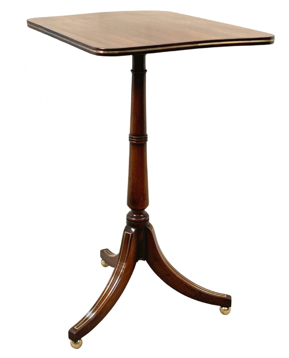 A nineteenth-century Regency rosewood occasional table featuring a rectangular top with rounded corners, fine brass inlay stringing, a turned central column, and a tripod base resting on brass feet. View III