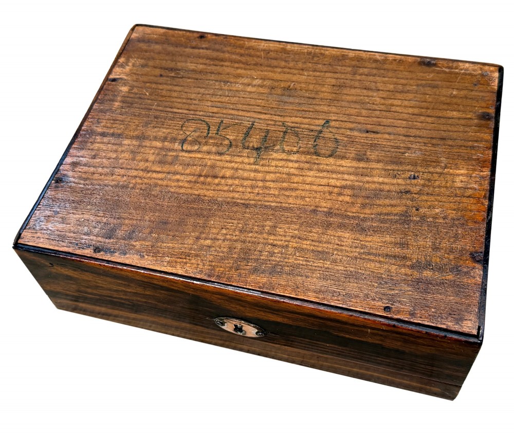 A 19th-century rectangular coromandel wood work box featuring a hinged lid, rich striped graining, and a central escutcheon. View VIII