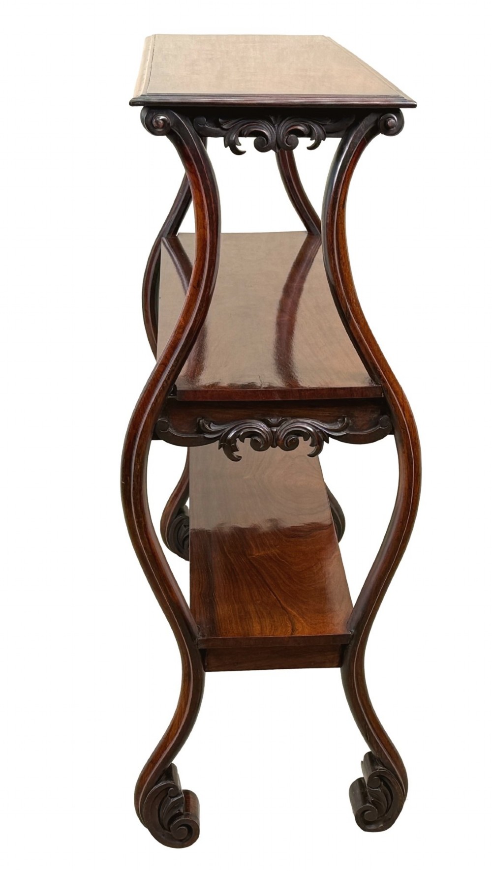 A mid-19th century three-tier rosewood standing buffet unit featuring curved leg supports and carved scroll details. View III