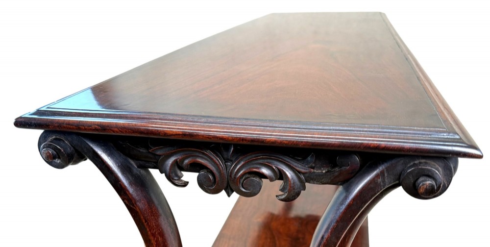 A mid-19th century three-tier rosewood standing buffet unit featuring curved leg supports and carved scroll details. View IV