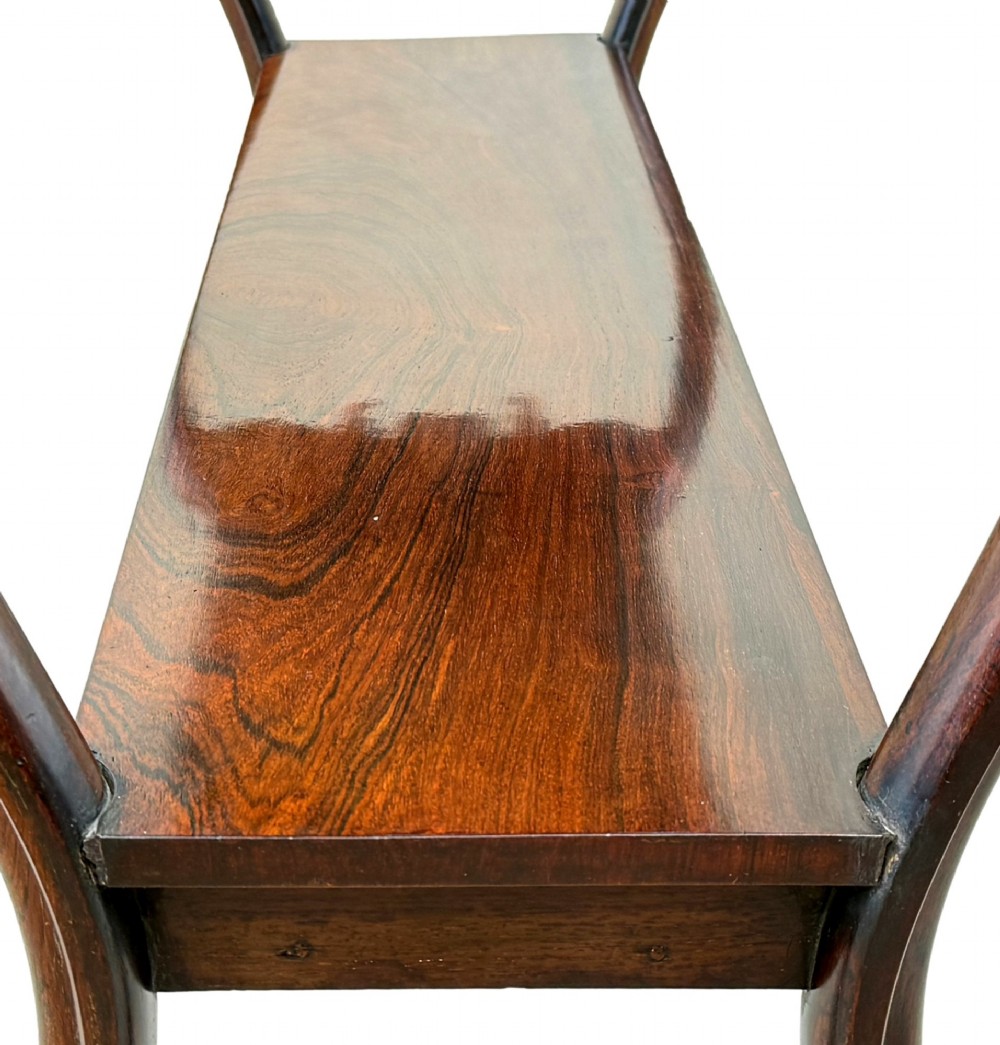 A mid-19th century three-tier rosewood standing buffet unit featuring curved leg supports and carved scroll details. View IX