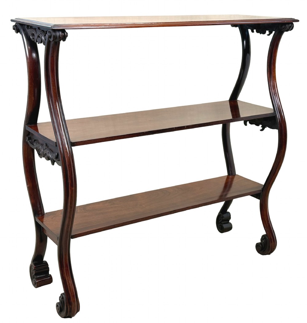 A mid-19th century three-tier rosewood standing buffet unit featuring curved leg supports and carved scroll details. View XIII