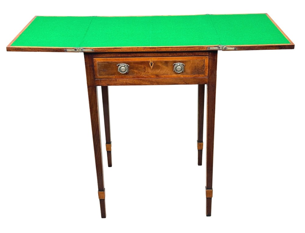 An 18th-century Georgian mahogany patience table featuring a folding top, brass corner brackets, a single drawer with ring handles, and square tapered legs. View V
