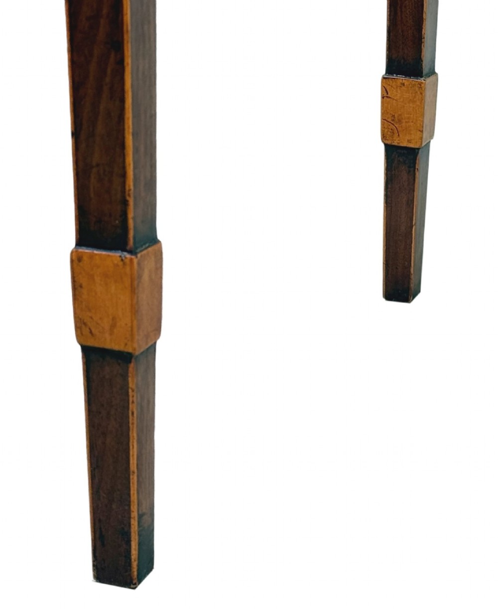 An 18th-century Georgian mahogany patience table featuring a folding top, brass corner brackets, a single drawer with ring handles, and square tapered legs. View IX