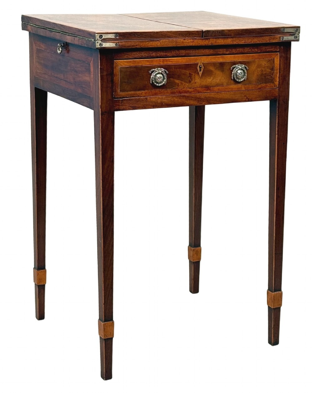 An 18th-century Georgian mahogany patience table featuring a folding top, brass corner brackets, a single drawer with ring handles, and square tapered legs. View XII