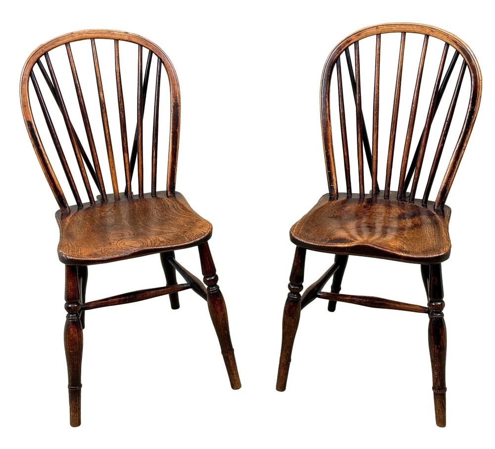 A set of six 19th-century dark wooden farmhouse dining chairs featuring hoop backs with vertical spindles and turned legs. View VI
