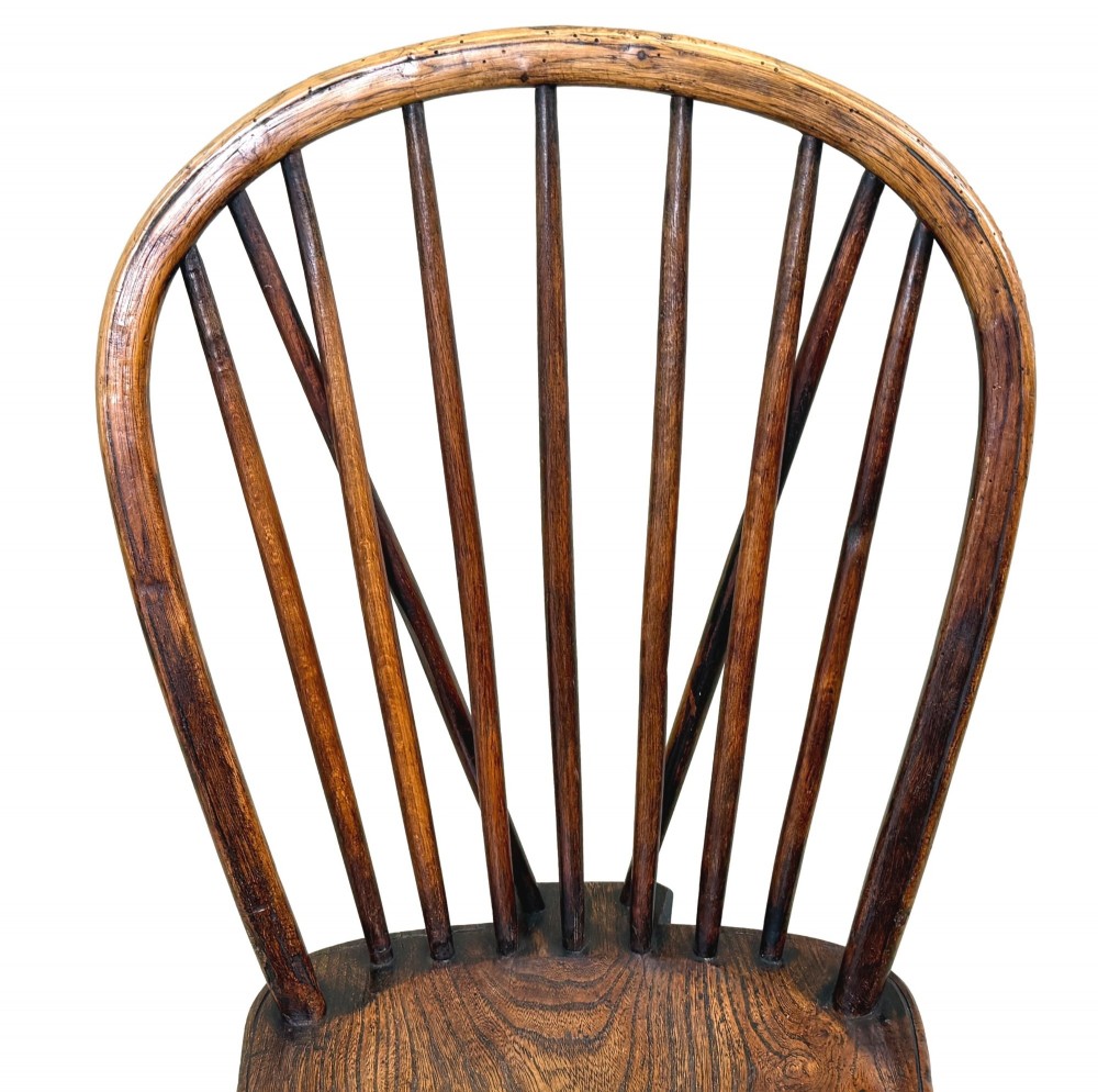A set of six 19th-century dark wooden farmhouse dining chairs featuring hoop backs with vertical spindles and turned legs. View IX