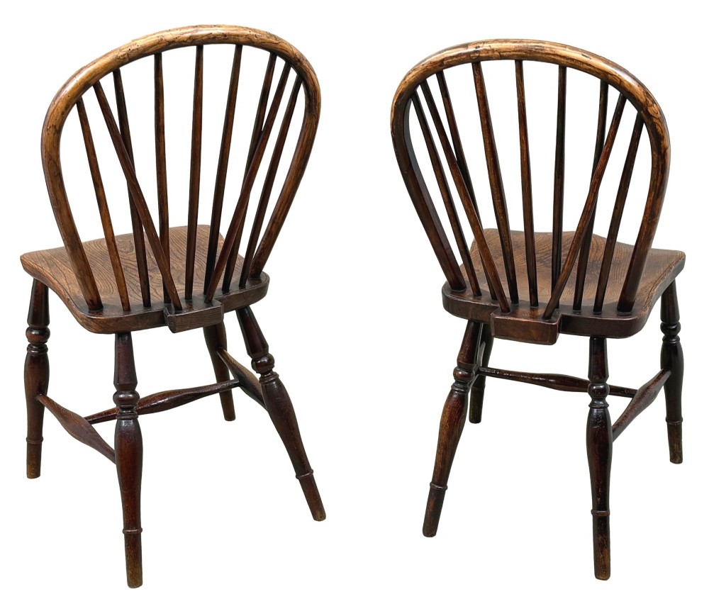A set of six 19th-century dark wooden farmhouse dining chairs featuring hoop backs with vertical spindles and turned legs. View XIII