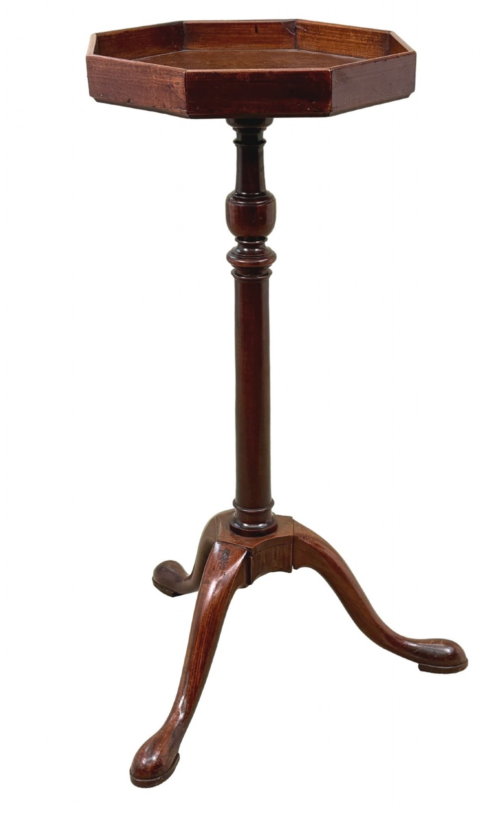An 18th-century Georgian mahogany torchere stand featuring an octagonal tray top with raised gallery, a turned column, and a tripod base.