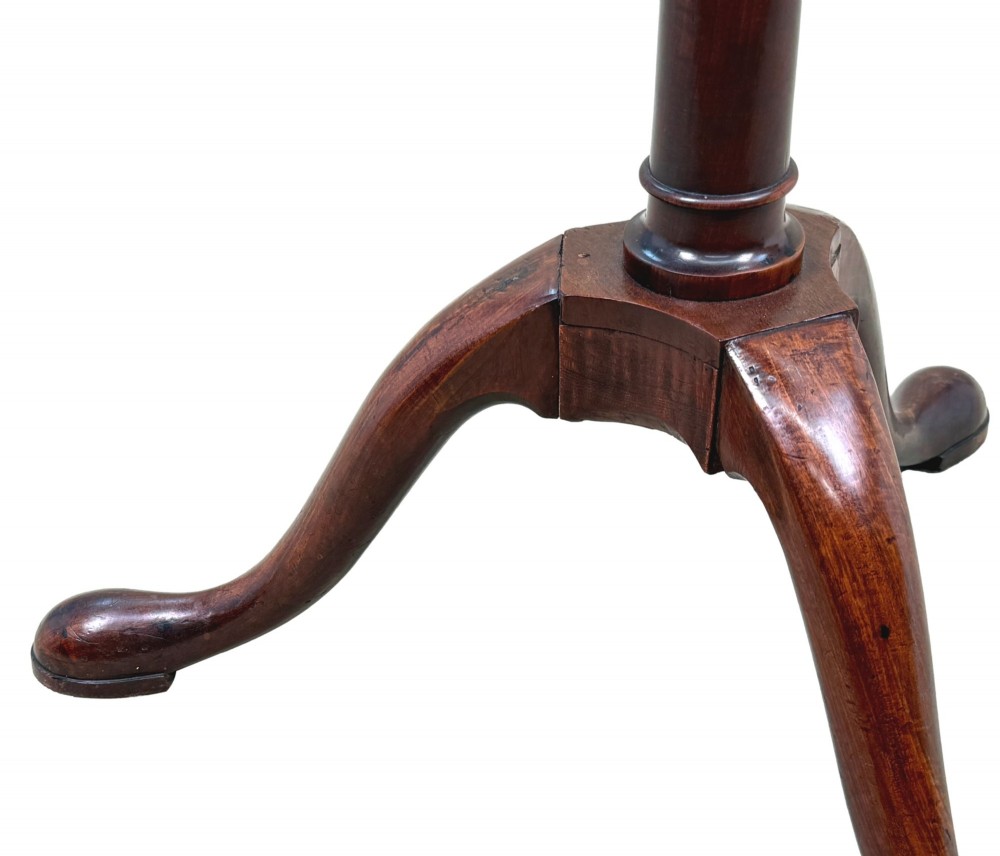An 18th-century Georgian mahogany torchere stand featuring an octagonal tray top with raised gallery, a turned column, and a tripod base. View IV