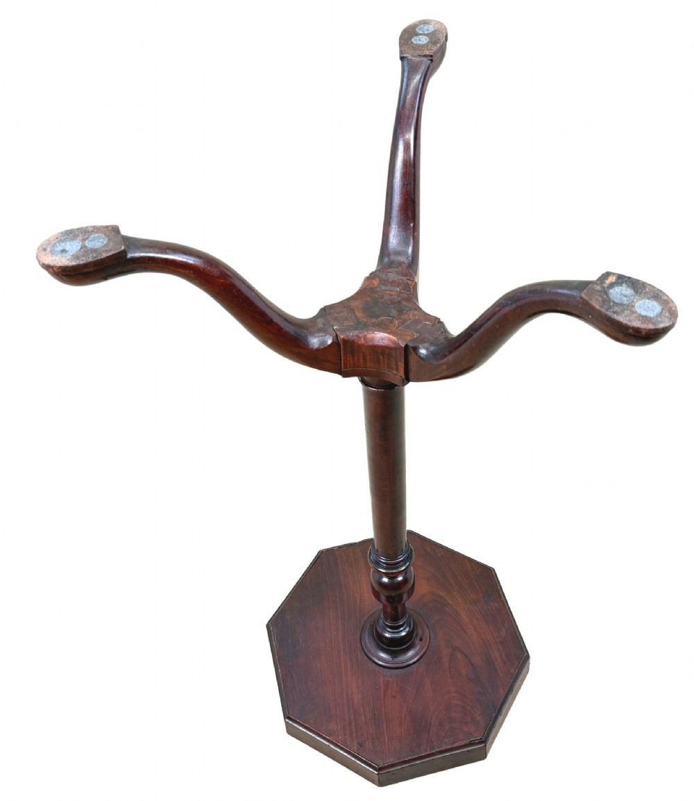 An 18th-century Georgian mahogany torchere stand featuring an octagonal tray top with raised gallery, a turned column, and a tripod base. View IX
