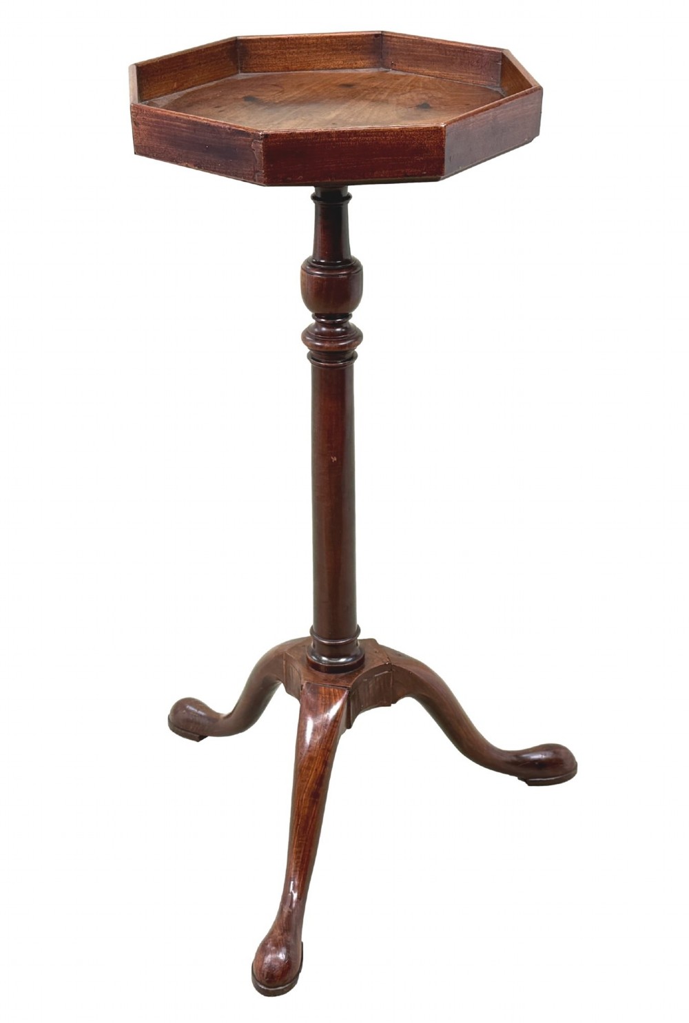 An 18th-century Georgian mahogany torchere stand featuring an octagonal tray top with raised gallery, a turned column, and a tripod base. View X