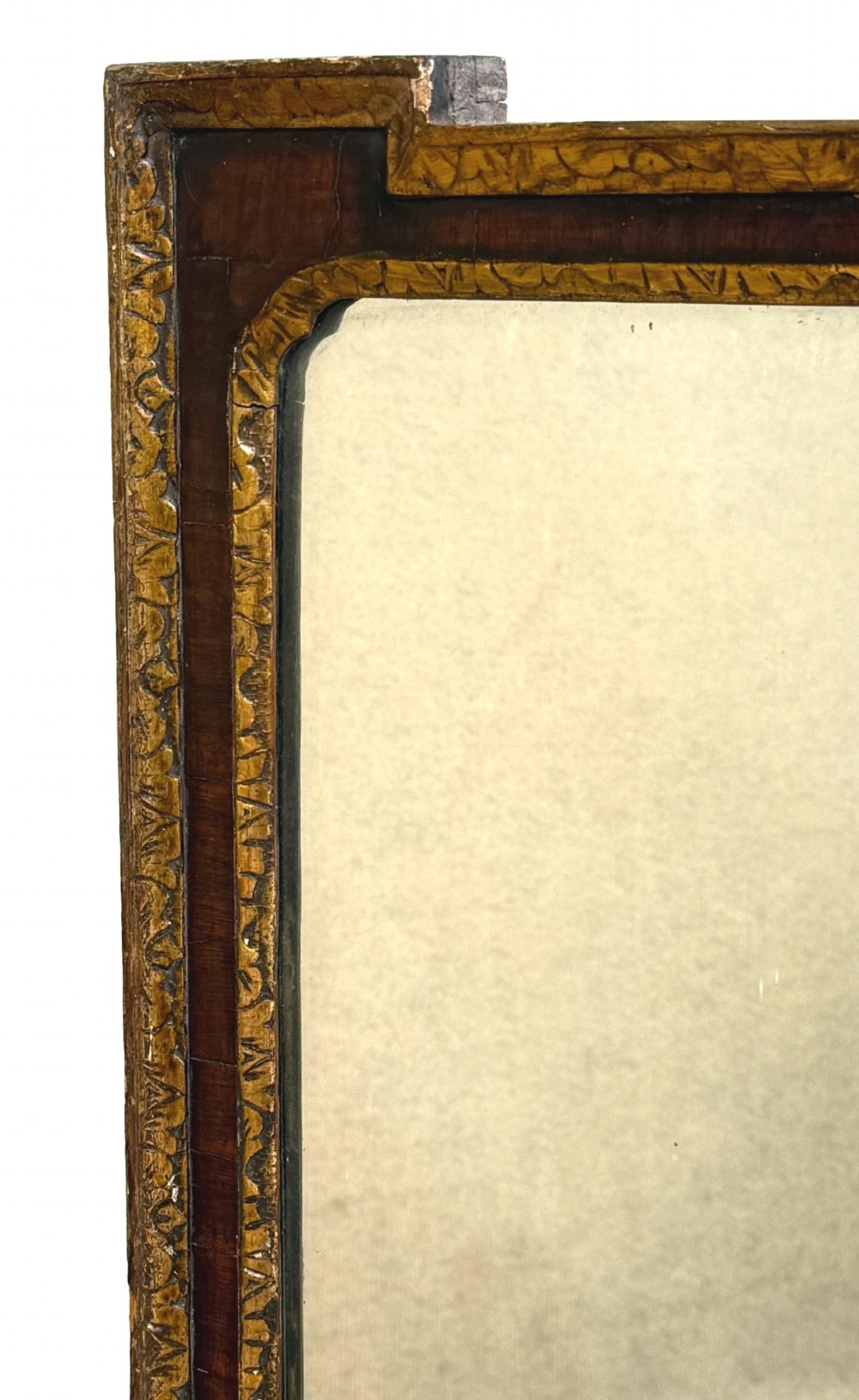 An early 18th-century rectangular wall mirror featuring a dark walnut frame bordered with gilded leaf mouldings and stepped projecting corners. View II