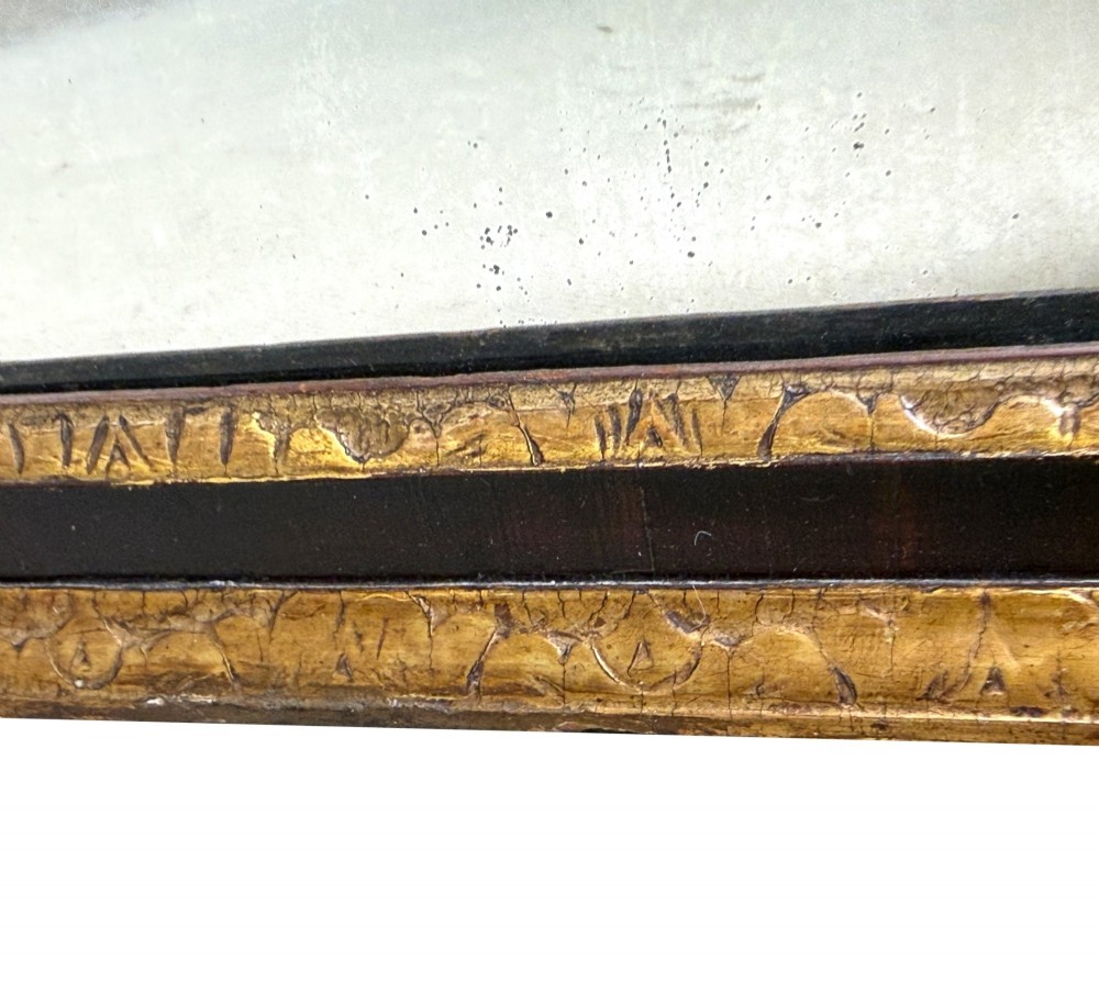 An early 18th-century rectangular wall mirror featuring a dark walnut frame bordered with gilded leaf mouldings and stepped projecting corners. View III