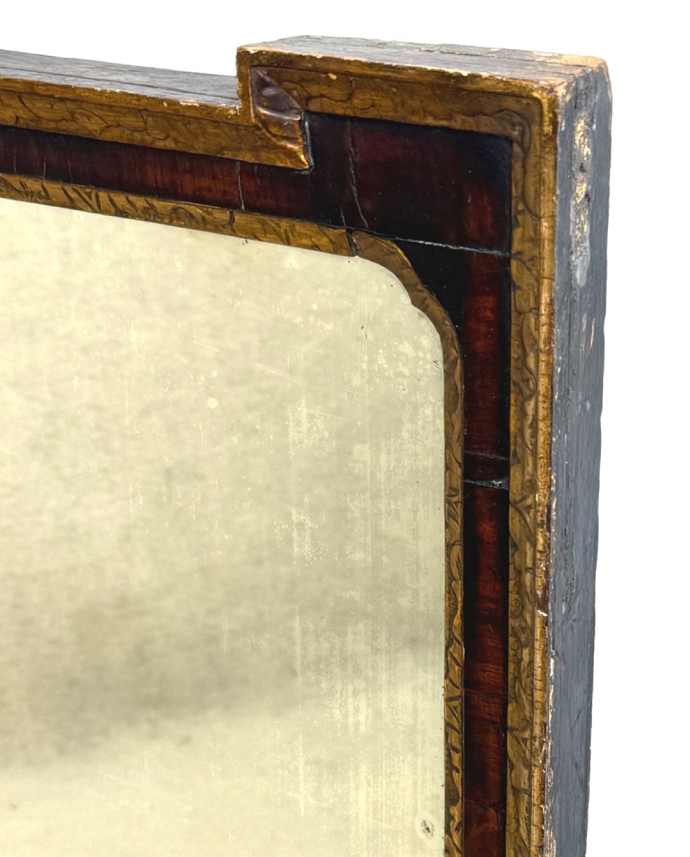 An early 18th-century rectangular wall mirror featuring a dark walnut frame bordered with gilded leaf mouldings and stepped projecting corners. View VII