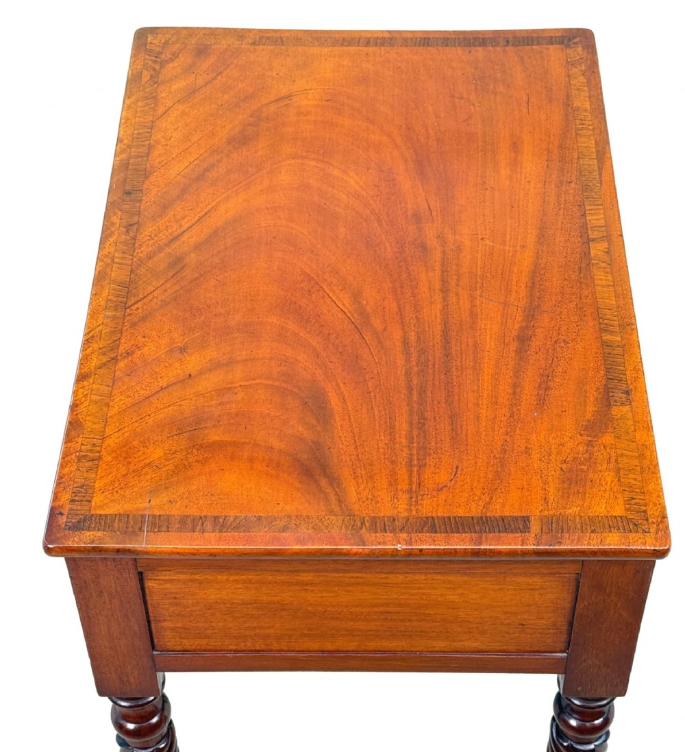 A 19th-century Regency mahogany occasional table featuring a single drawer with brass knobs, spiral turned legs, and brass castors. View IV