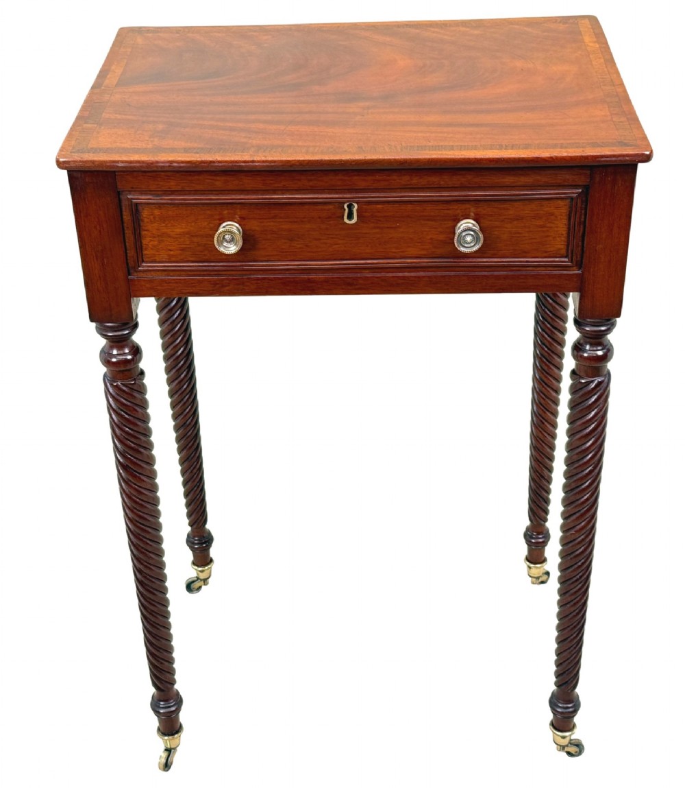 A 19th-century Regency mahogany occasional table featuring a single drawer with brass knobs, spiral turned legs, and brass castors. View VIII