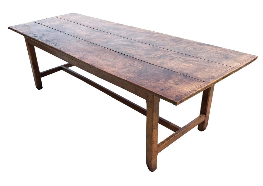 An 18th-century English farmhouse dining table crafted from warm brown oak with a wide three-plank top, plain apron, and an H-stretcher base. View XII