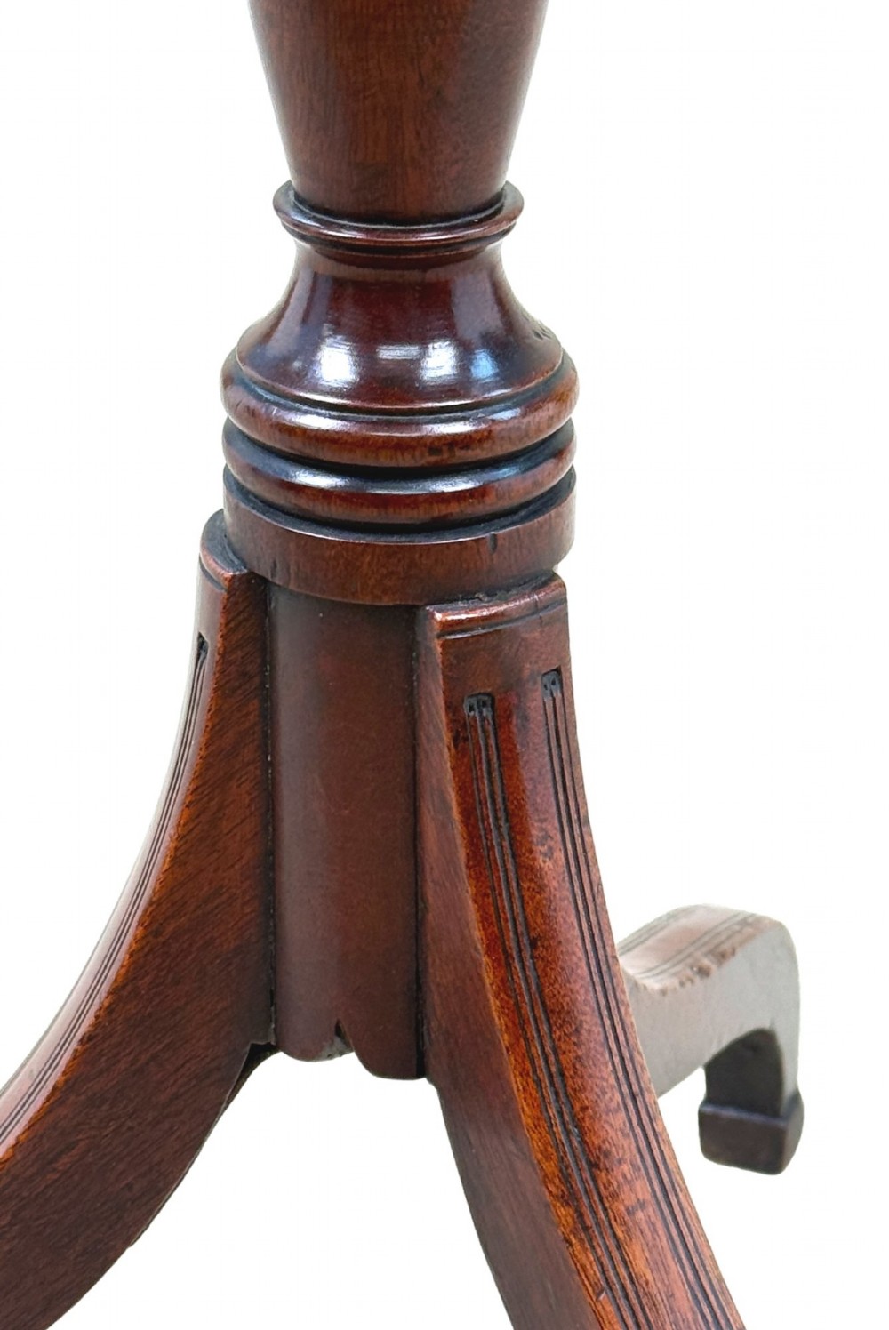 An 18th-century Georgian mahogany wine table featuring a flat circular top supported by a turned central column and three slender cabriole tripod legs. View VI