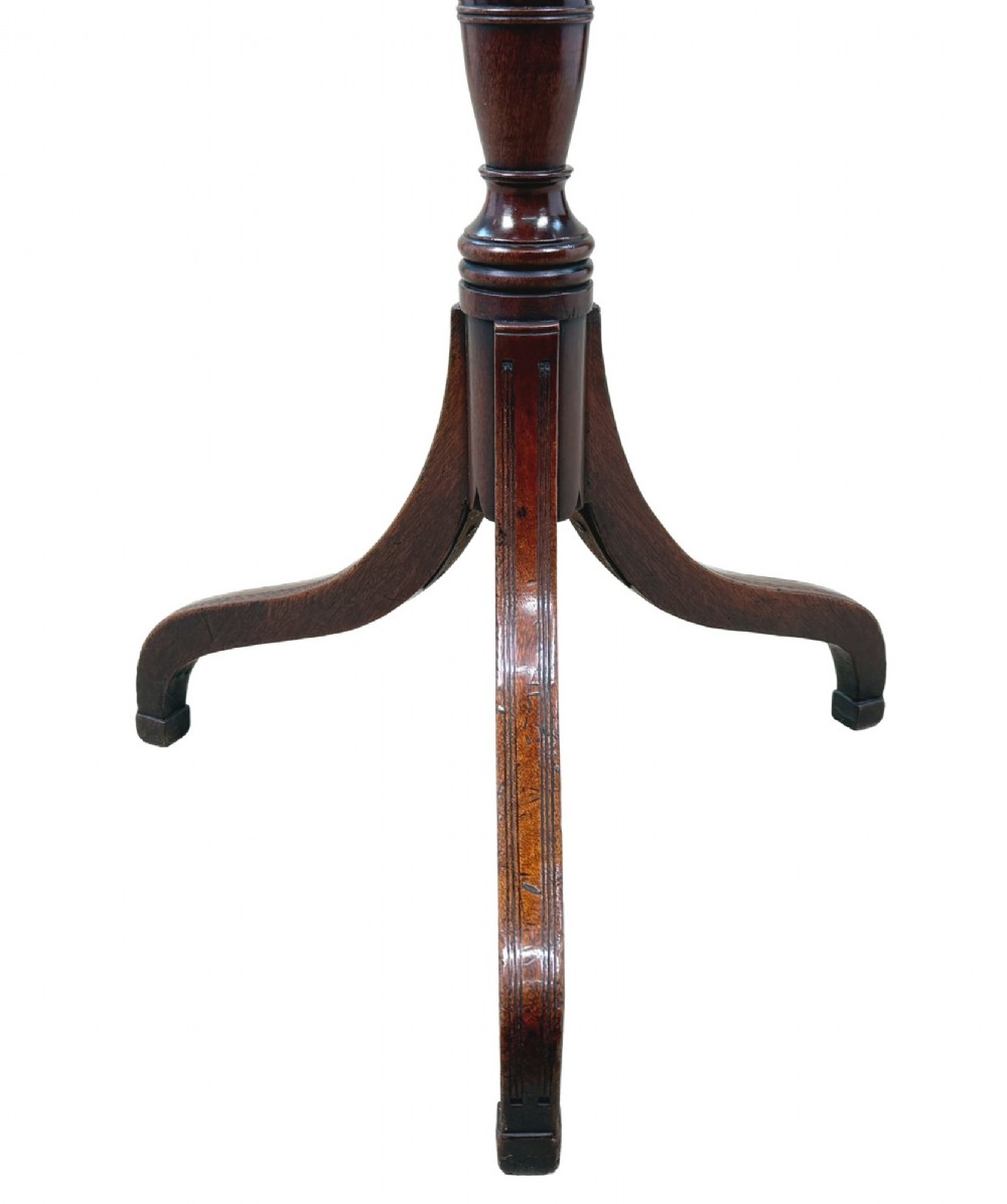 An 18th-century Georgian mahogany wine table featuring a flat circular top supported by a turned central column and three slender cabriole tripod legs. View VIII