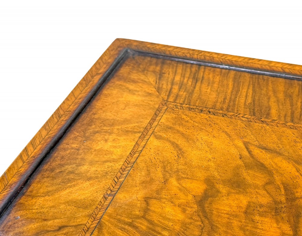 A set of four early twentieth-century brown walnut nesting tables featuring barley twist legs, arched stretchers, and banded inlaid tops stacked in graduated size. View X