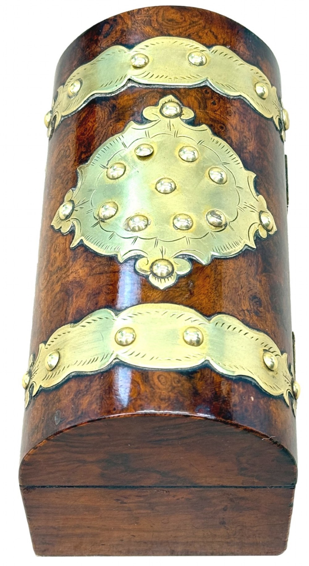 A nineteenth-century domed stationery box crafted from highly figured burr walnut with ornamental brass strapwork and studs. View II