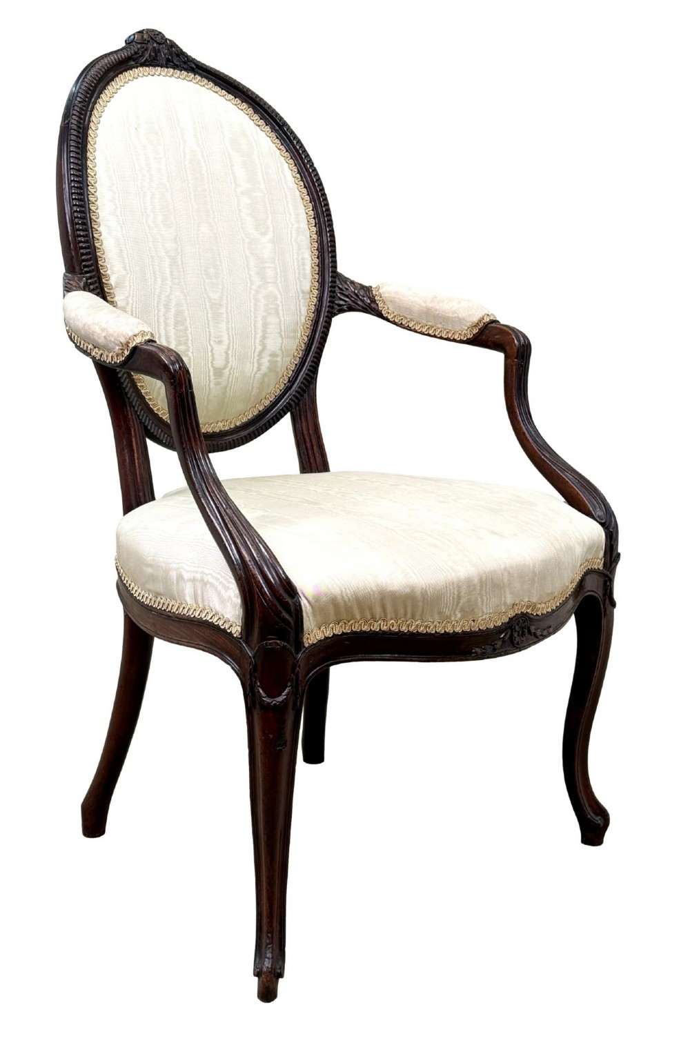An 18th-century Georgian mahogany salon chair featuring an oval back rest, carved wooden frame, and cream silk upholstery. View XII