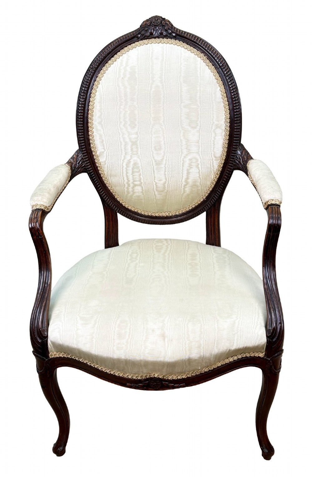 An 18th-century Georgian mahogany salon chair featuring an oval back rest, carved wooden frame, and cream silk upholstery. View XV