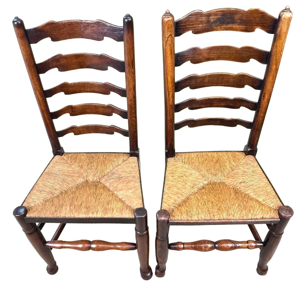 A set of ten early 19th-century Georgian country dining chairs featuring waved ladderback slats, woven rush seats, and turned wooden legs. View IV