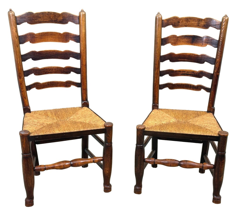 A set of ten early 19th-century Georgian country dining chairs featuring waved ladderback slats, woven rush seats, and turned wooden legs. View VII