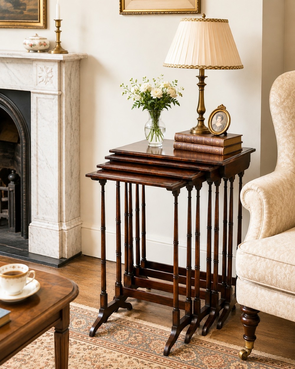 A set of four Regency period rosewood quartetto nesting tables with slender faux-bamboo turned legs and trestle feet. View III