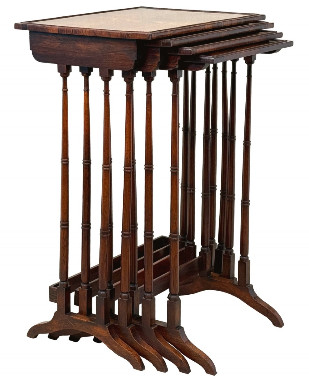 A set of four Regency period rosewood quartetto nesting tables with slender faux-bamboo turned legs and trestle feet. View VI