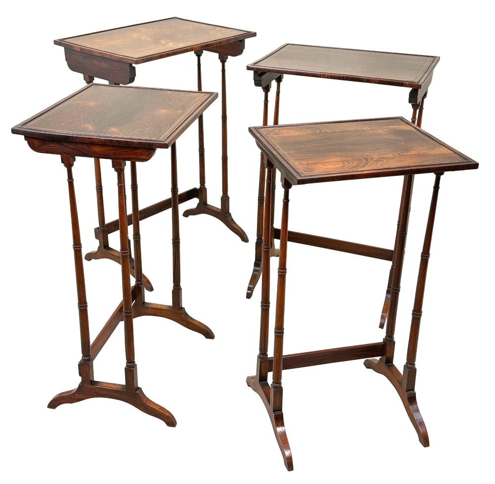 A set of four Regency period rosewood quartetto nesting tables with slender faux-bamboo turned legs and trestle feet. View VII