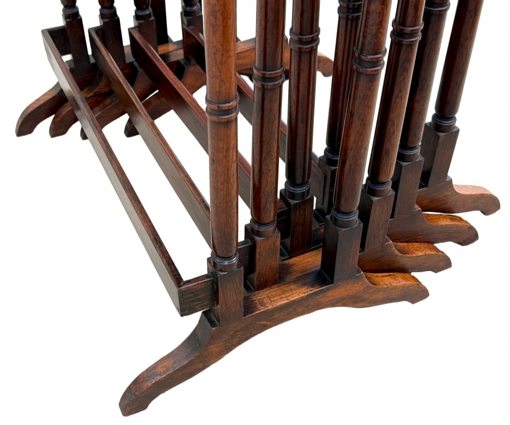 A set of four Regency period rosewood quartetto nesting tables with slender faux-bamboo turned legs and trestle feet. View XI