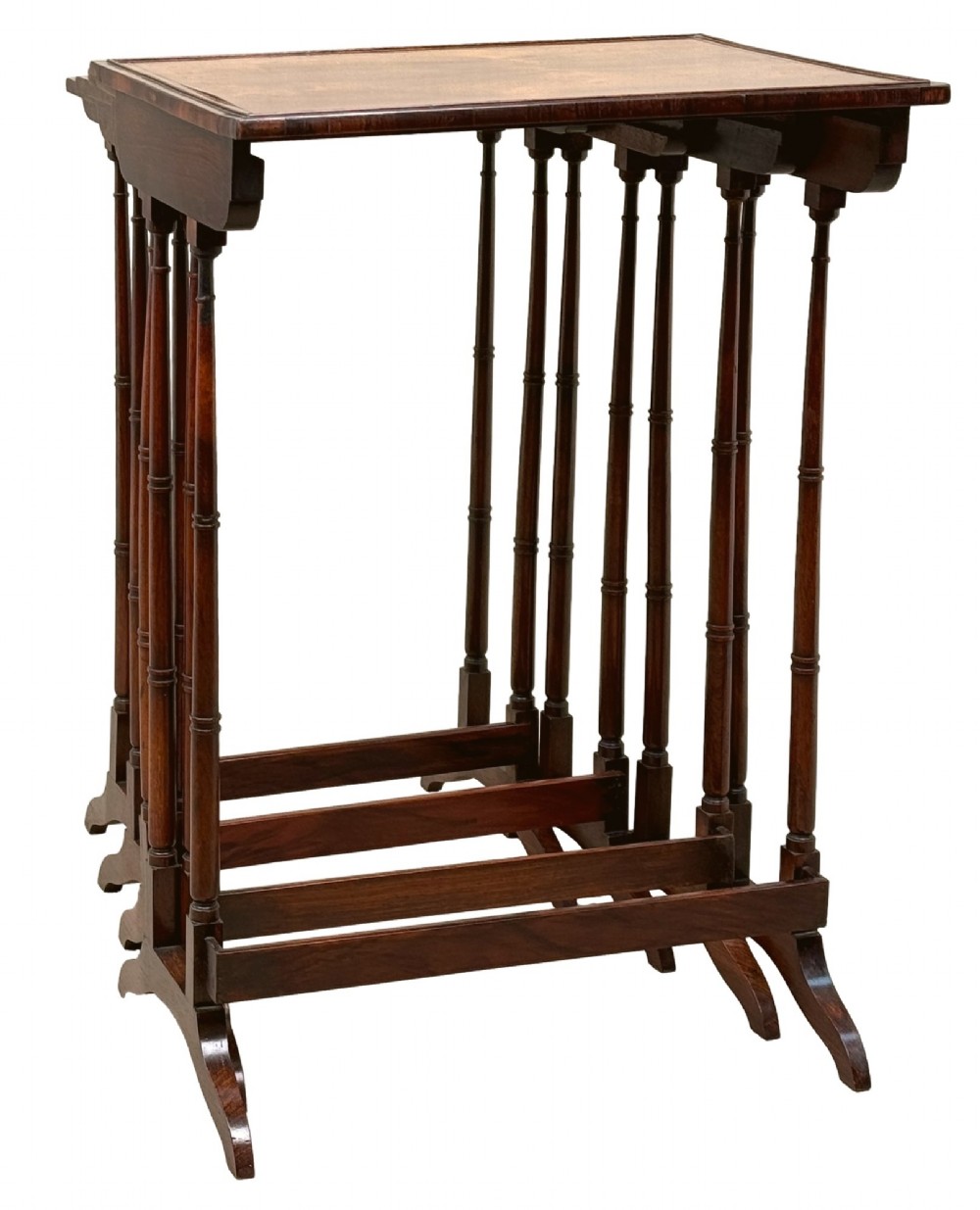 A set of four Regency period rosewood quartetto nesting tables with slender faux-bamboo turned legs and trestle feet. View XII