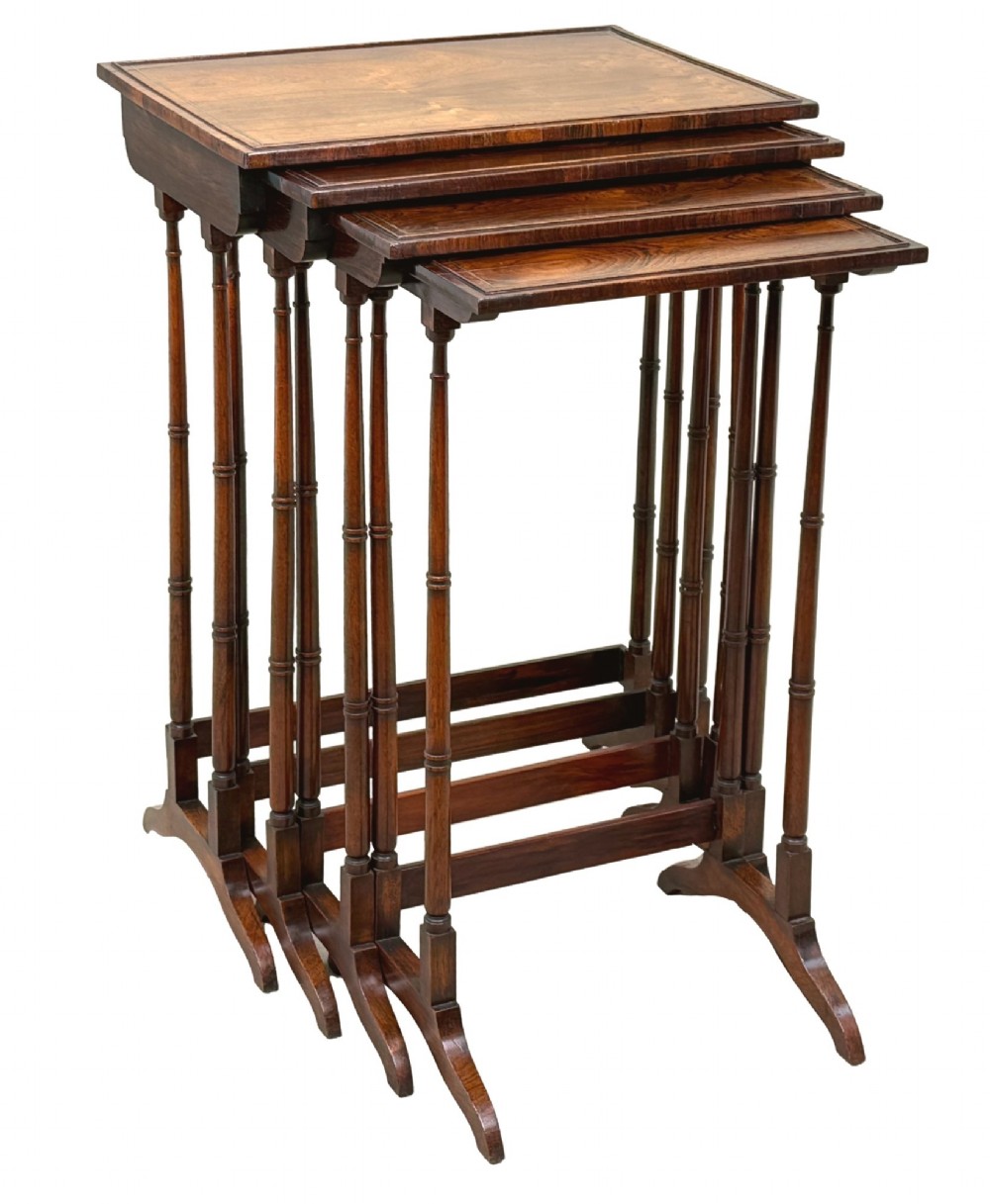 A set of four Regency period rosewood quartetto nesting tables with slender faux-bamboo turned legs and trestle feet. View XIV