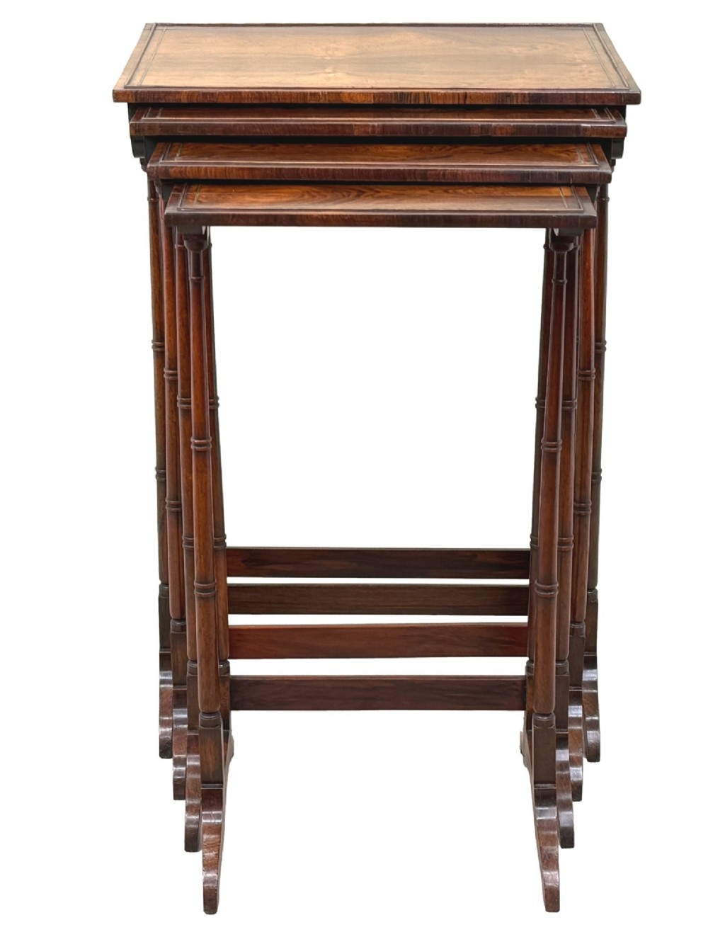 A set of four Regency period rosewood quartetto nesting tables with slender faux-bamboo turned legs and trestle feet. View XV