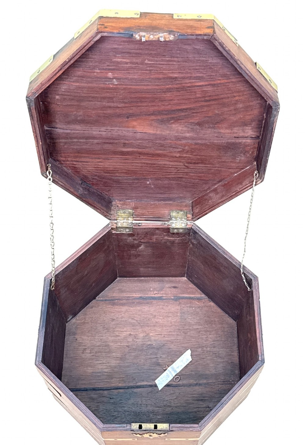An octagonal eighteenth-century Anglo-Indian padouk wood cellarette with brass corner straps, keyhole escutcheon, and carrying handles, supported on four cabriole legs. View IV