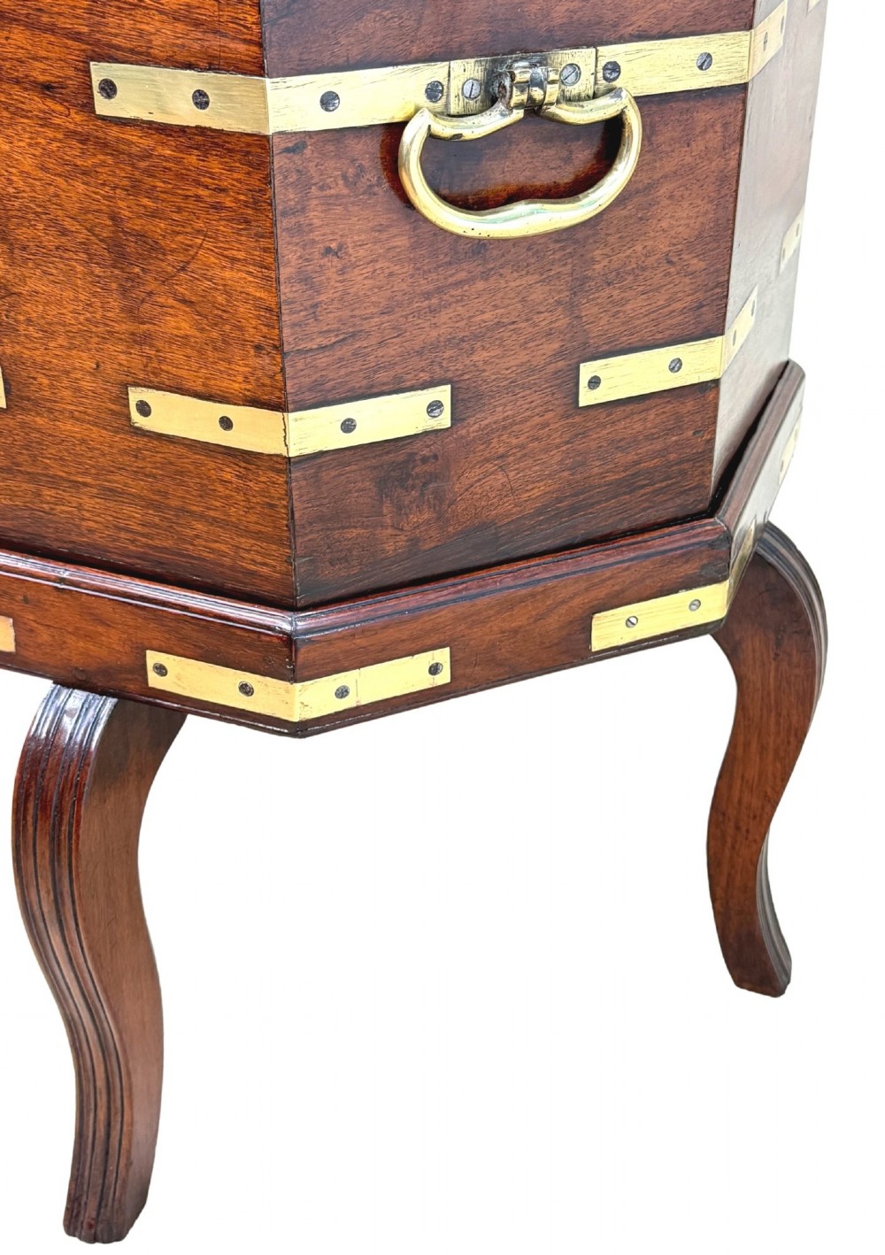 An octagonal eighteenth-century Anglo-Indian padouk wood cellarette with brass corner straps, keyhole escutcheon, and carrying handles, supported on four cabriole legs. View VI