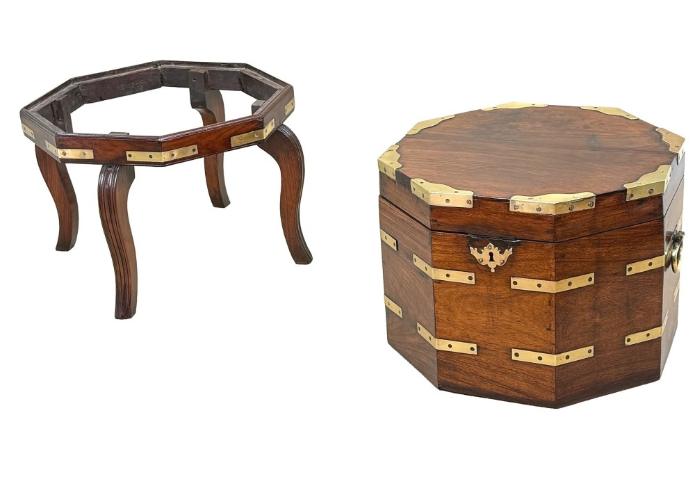An octagonal eighteenth-century Anglo-Indian padouk wood cellarette with brass corner straps, keyhole escutcheon, and carrying handles, supported on four cabriole legs. View VII
