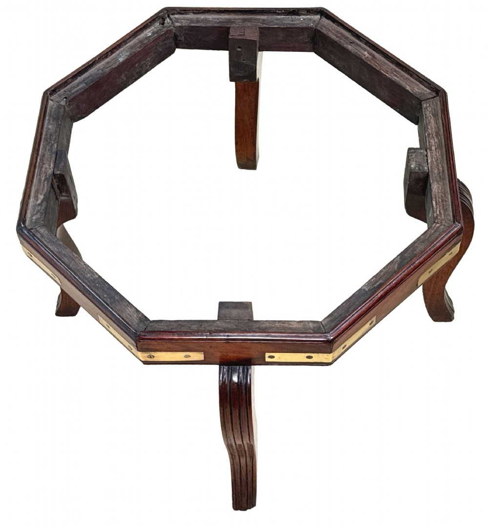 An octagonal eighteenth-century Anglo-Indian padouk wood cellarette with brass corner straps, keyhole escutcheon, and carrying handles, supported on four cabriole legs. View XI