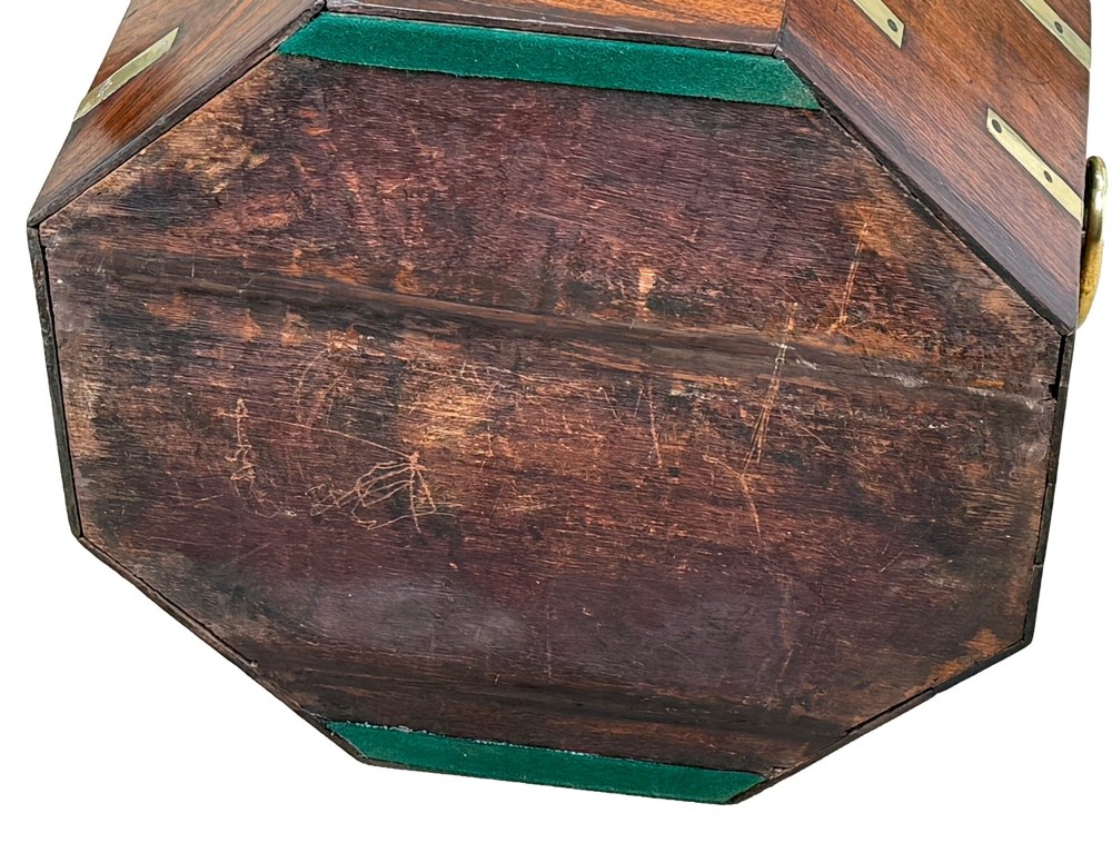 An octagonal eighteenth-century Anglo-Indian padouk wood cellarette with brass corner straps, keyhole escutcheon, and carrying handles, supported on four cabriole legs. View XIV