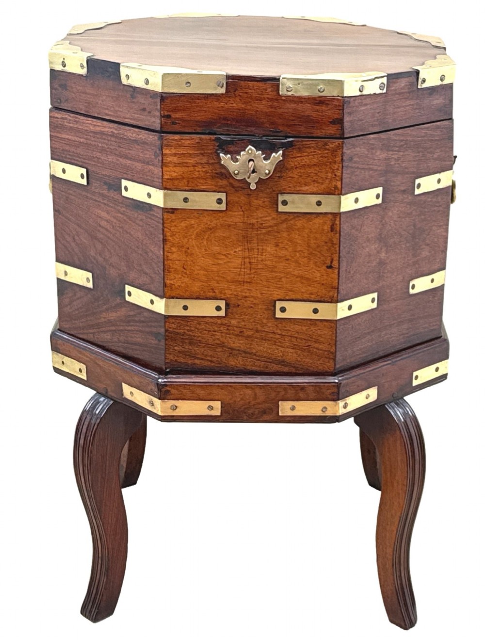 An octagonal eighteenth-century Anglo-Indian padouk wood cellarette with brass corner straps, keyhole escutcheon, and carrying handles, supported on four cabriole legs. View XV